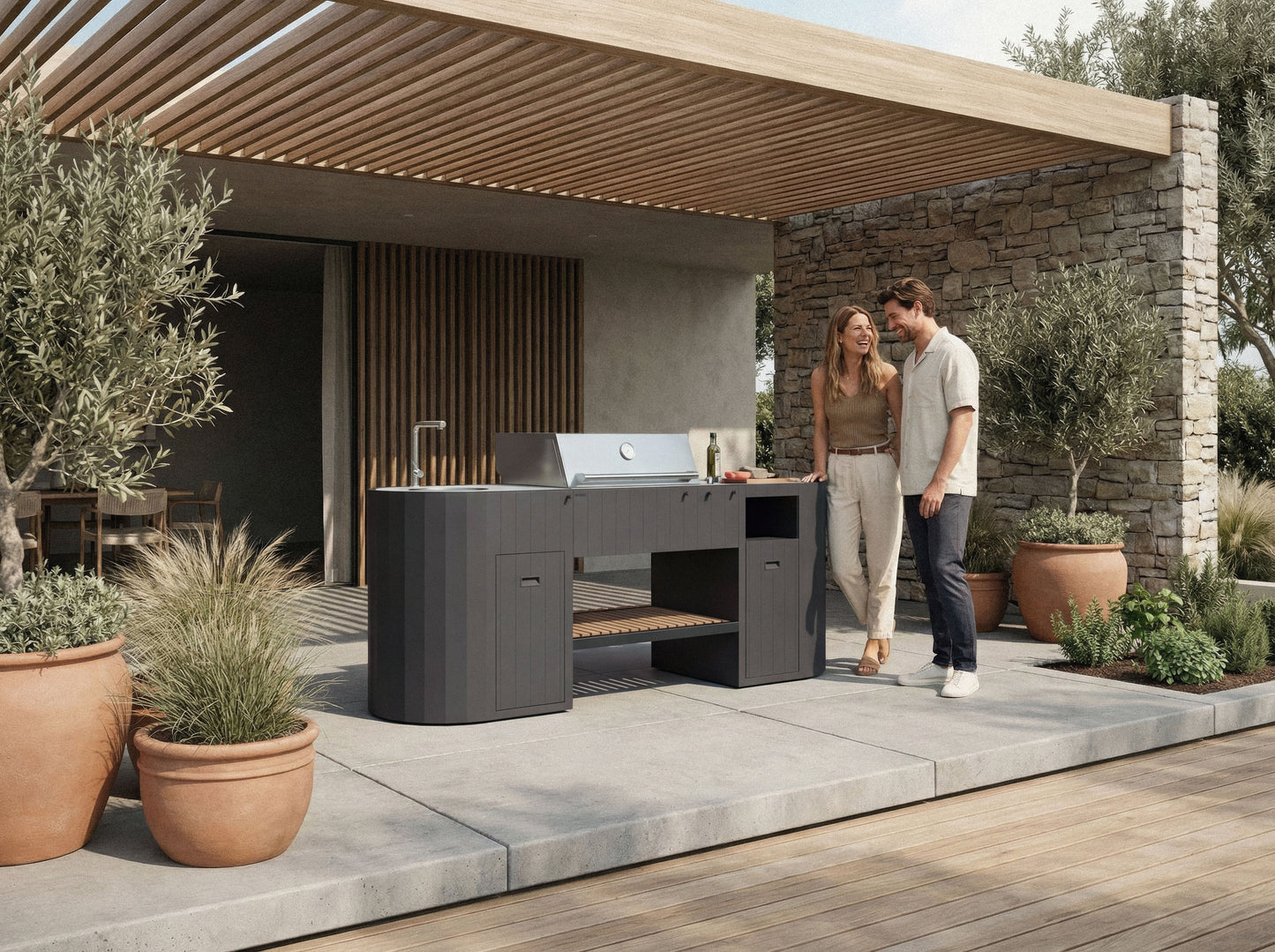 Couple cooking at the OVO GL outdoor kitchen on a garden terrace