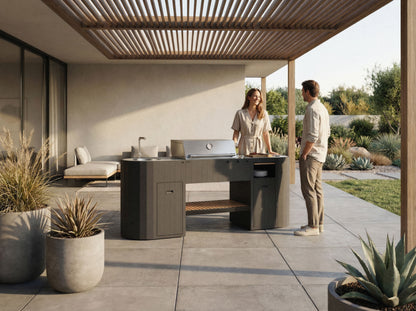 Couple talking at the OVO GL outdoor kitchen under a wooden pergola