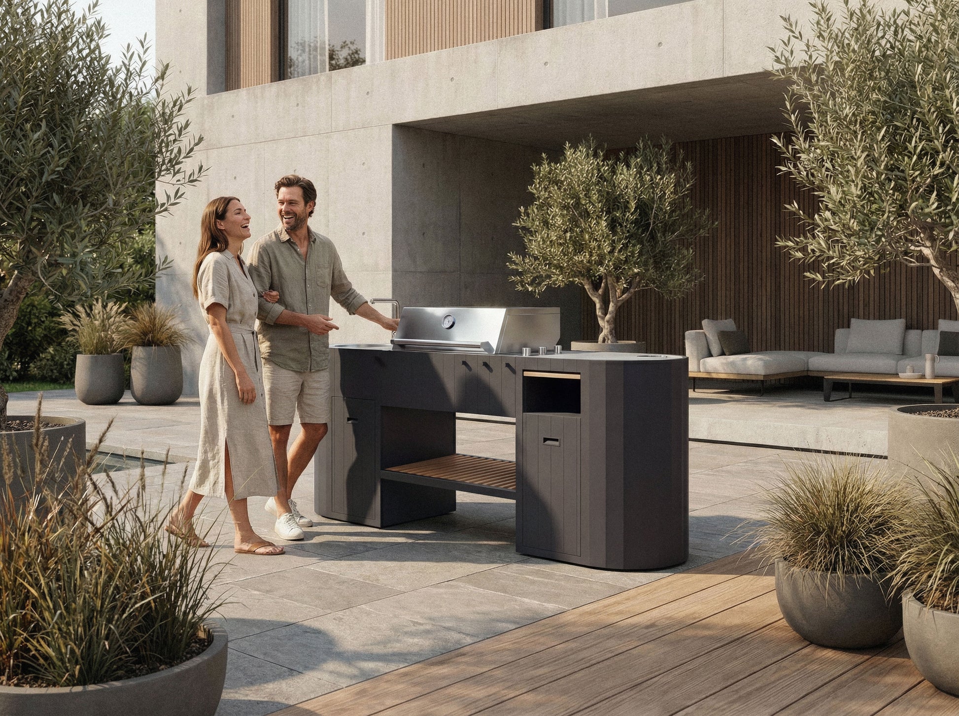 Couple by the OVO GL outdoor kitchen in a modern backyard