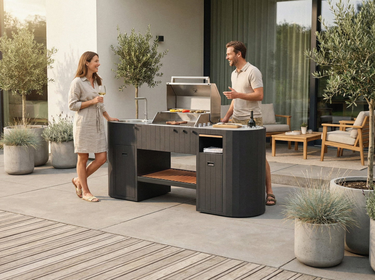 Friends grilling on the OVO GL outdoor kitchen on a stone patio
